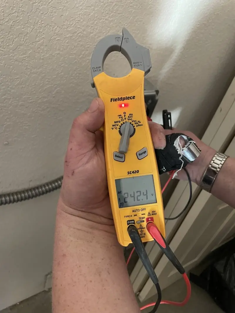 Voltage testing with clamp meter during Electrical Installation Services in Gresham